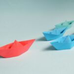 Paper boats on solid surface
